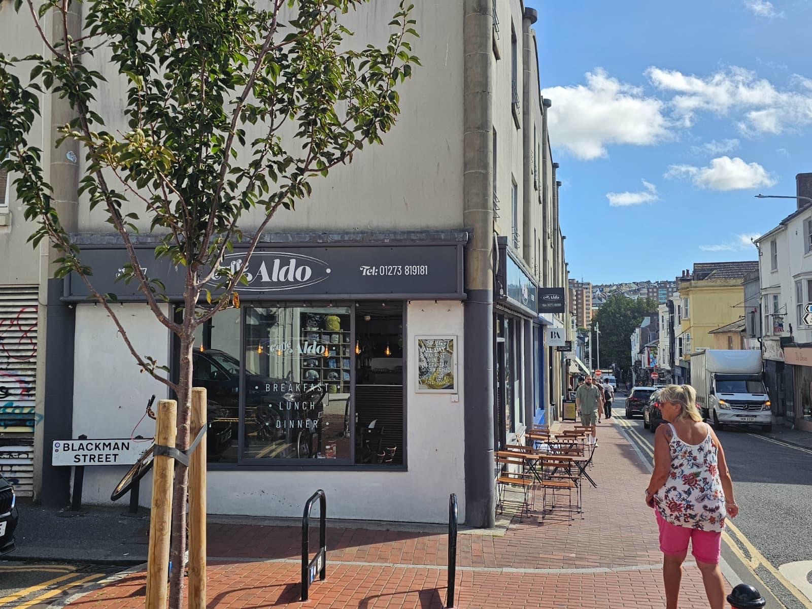 The Caffè Aldo corner on Blackman Street with outdoor seating